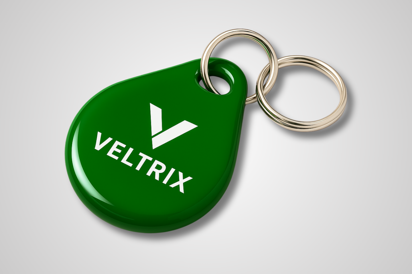 A photo of a green key fob with RFID and print
