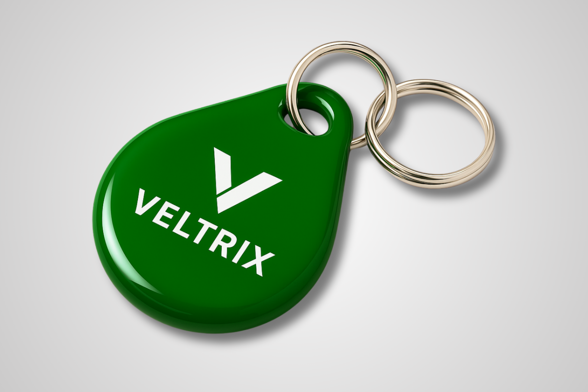 A photo of a green key fob with RFID and print