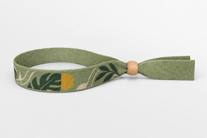 Green bamboo fabric wristband with leaf print and wooden lock